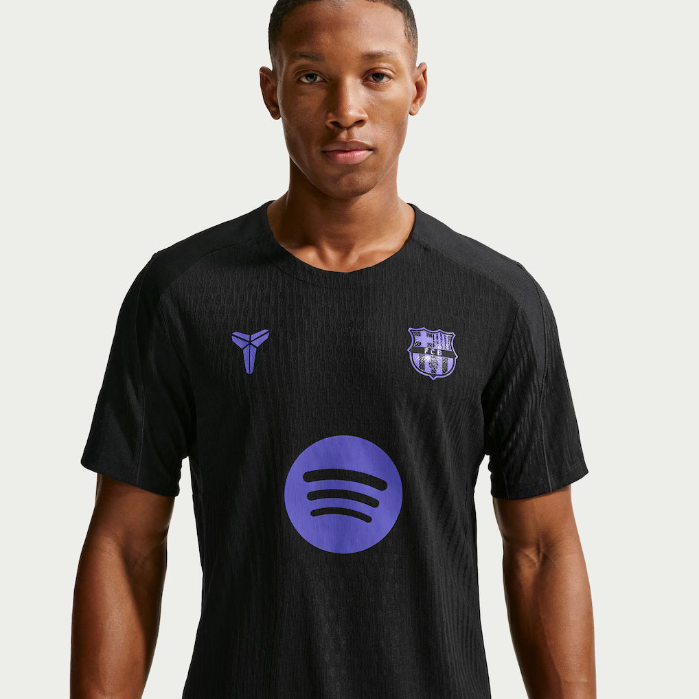 2025/26 NIKE FC BARCELONA AWAY KOBE STRIKE ELITE DRI-FIT ADV TRAINING TOP - Black product image 1, provided for visual